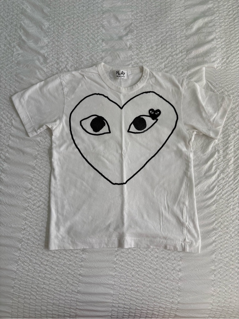 Comme des Garçons White Tee with Black Heart Eyes Graphic